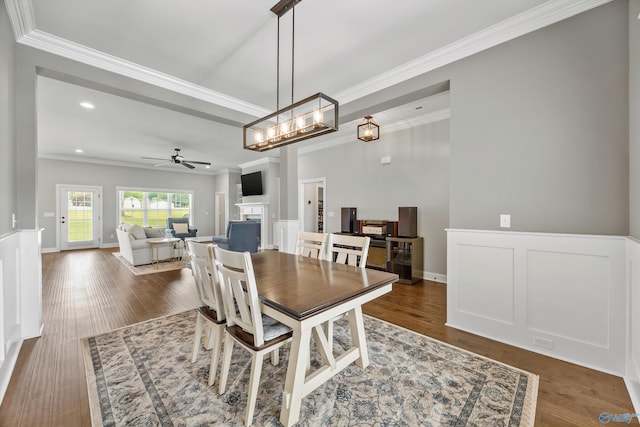106 Timber Springs Ct, Madison, AL 35756 - dining room with ornamental molding, ceiling fan, a fireplace, recessed lighting, and wood finished floors