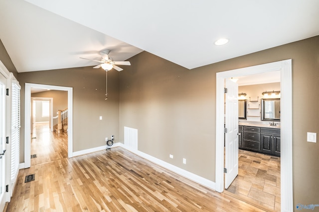 interior space featuring light hardwood / wood-style flooring, ceiling fan, and sink