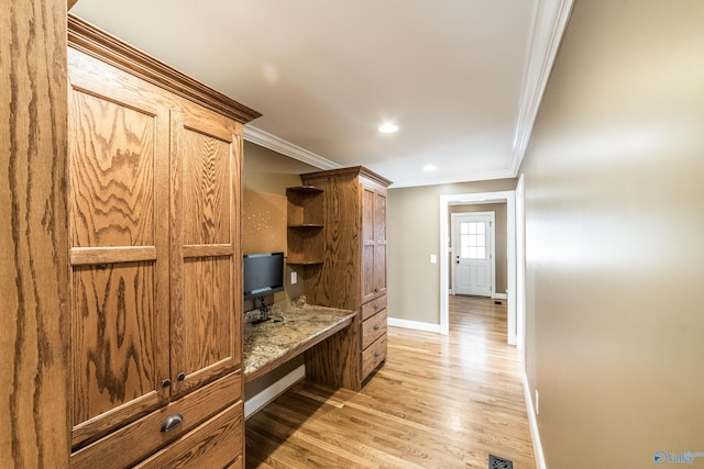 mudroom with light hardwood / wood-style floors and ornamental molding