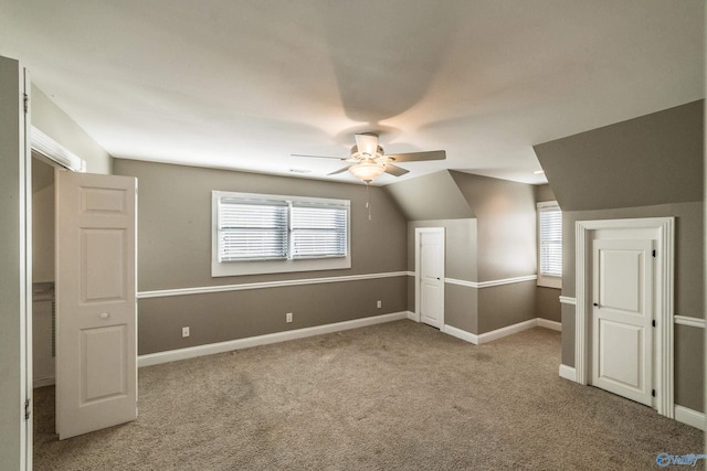 bonus room featuring carpet, vaulted ceiling, and ceiling fan