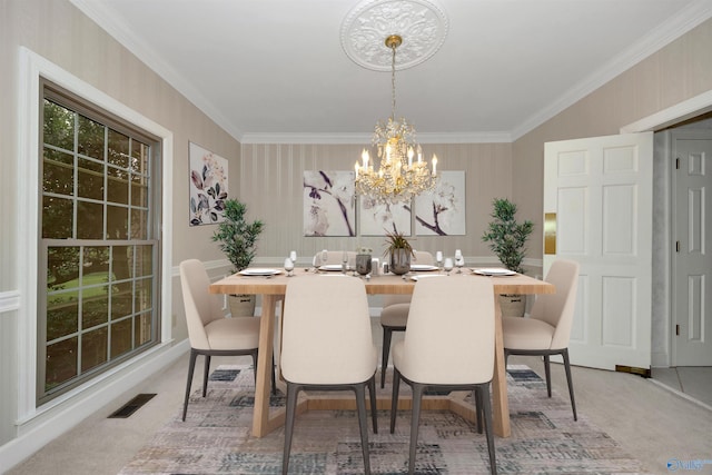 carpeted dining area featuring a notable chandelier and crown molding