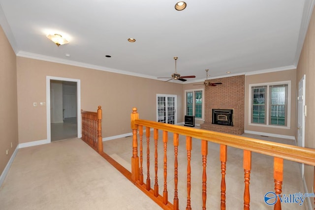 corridor with carpet floors and crown molding