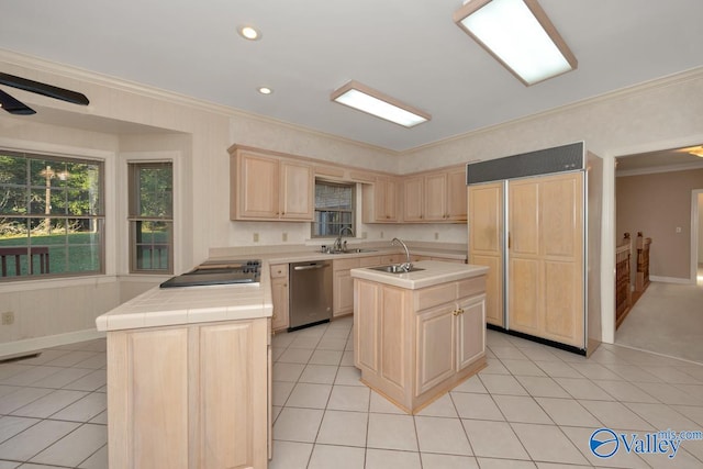 kitchen with tile countertops, dishwasher, light brown cabinets, a center island with sink, and ornamental molding