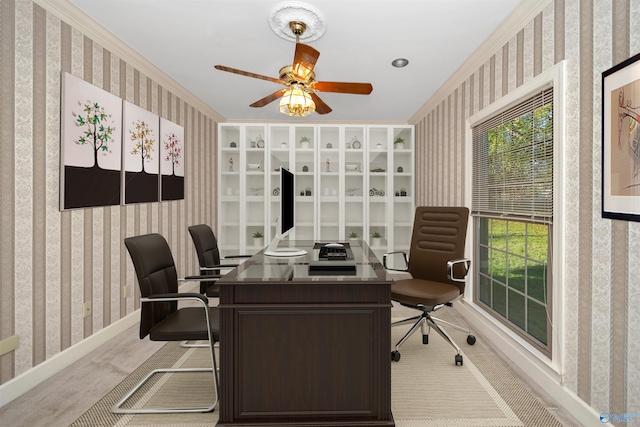 office area with crown molding, ceiling fan, and light colored carpet