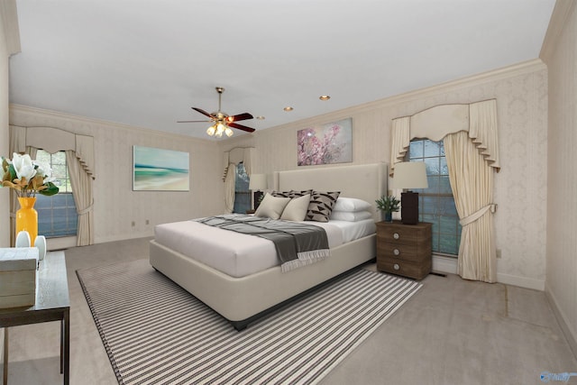 carpeted bedroom with ceiling fan and crown molding