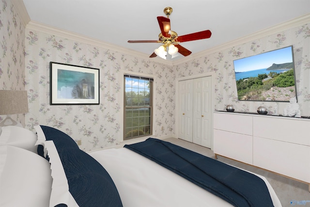 bedroom with a closet, ceiling fan, and ornamental molding