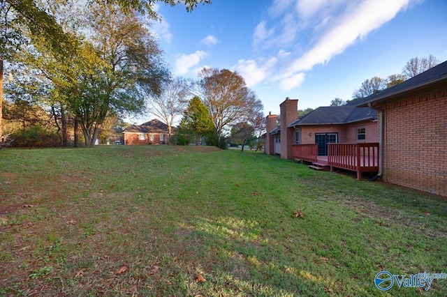 view of yard featuring a wooden deck