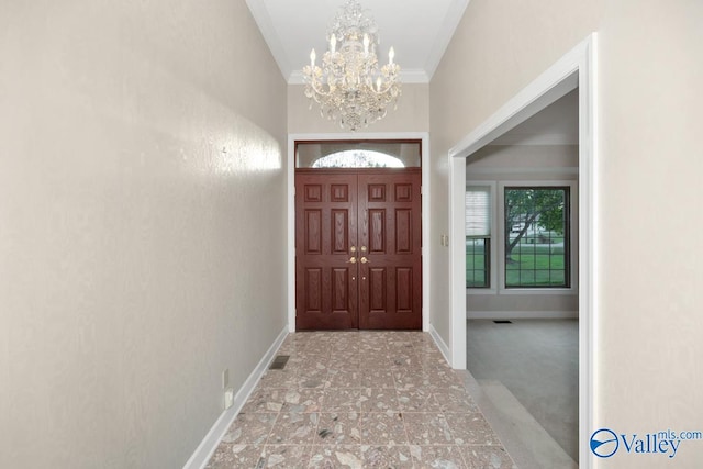 entryway featuring a notable chandelier and ornamental molding