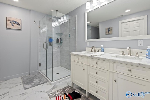 bathroom with vanity and an enclosed shower