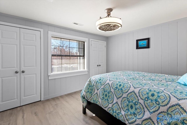 bedroom featuring light hardwood / wood-style floors and a closet