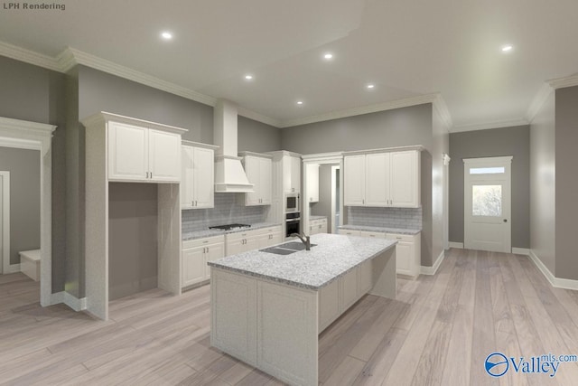 kitchen with white cabinetry, an island with sink, gas stovetop, and light wood-style floors