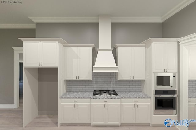 kitchen featuring decorative backsplash, white cabinets, appliances with stainless steel finishes, and ornamental molding