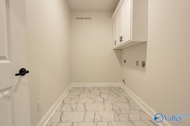 laundry room featuring baseboards, cabinet space, hookup for an electric dryer, and marble finish floor