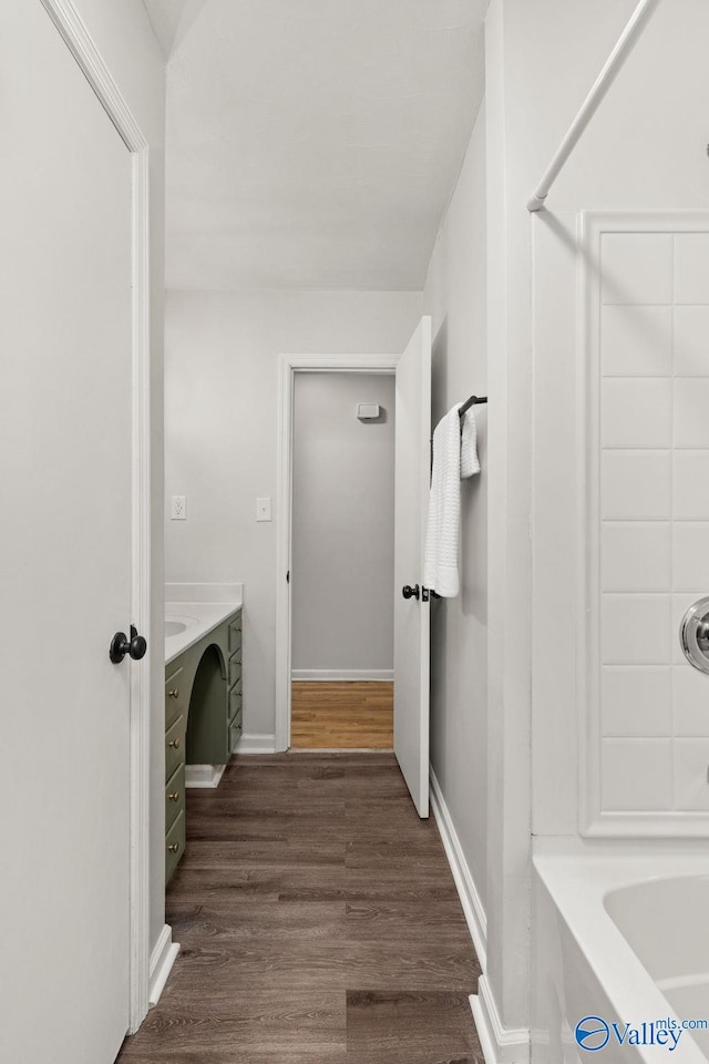 bathroom featuring vanity and hardwood / wood-style flooring