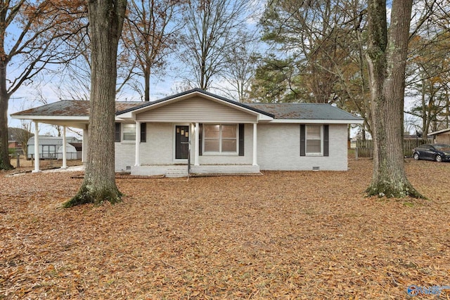 ranch-style home featuring a carport