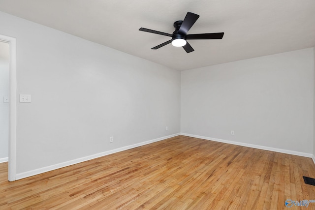 empty room featuring ceiling fan and light hardwood / wood-style floors