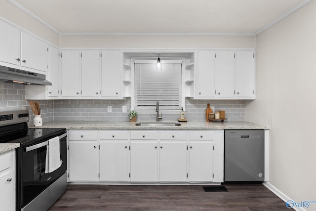 kitchen featuring appliances with stainless steel finishes, backsplash, dark wood-type flooring, sink, and white cabinets