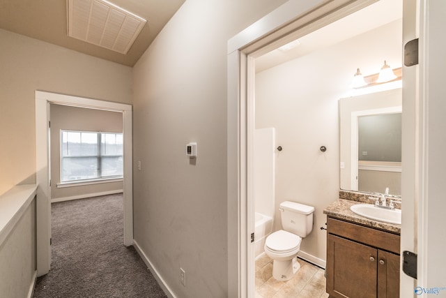 bathroom with vanity and toilet