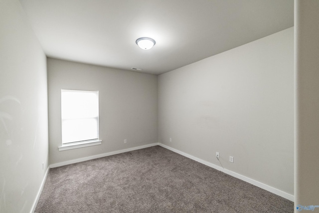 unfurnished room with carpet flooring