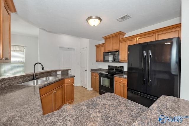 kitchen featuring sink and black appliances