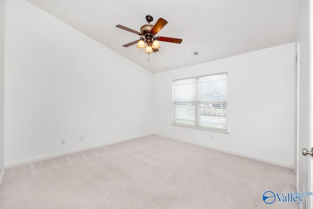 unfurnished room with ceiling fan, vaulted ceiling, and light carpet