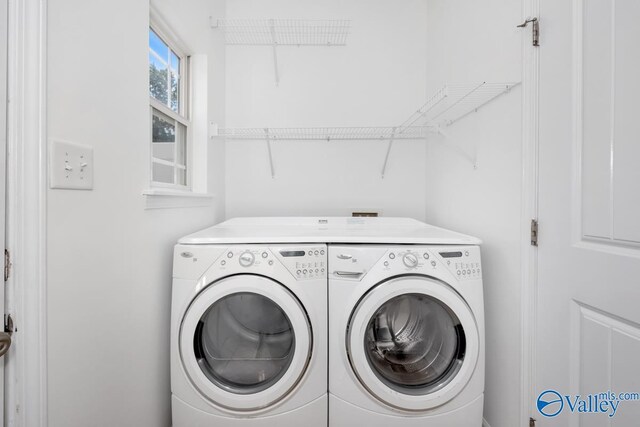 laundry room with independent washer and dryer