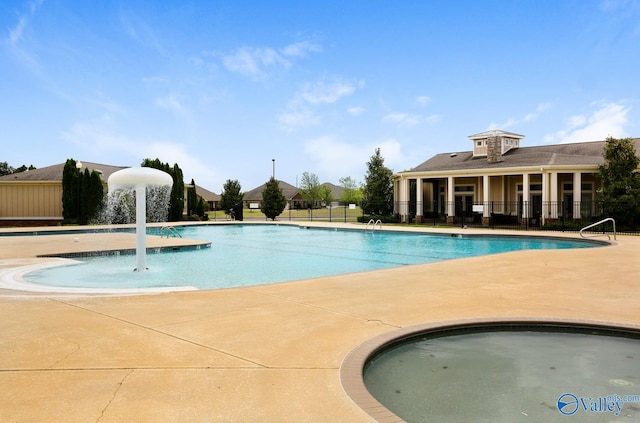 view of pool featuring a patio and pool water feature