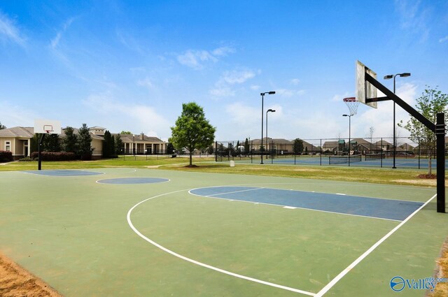 view of basketball court featuring tennis court