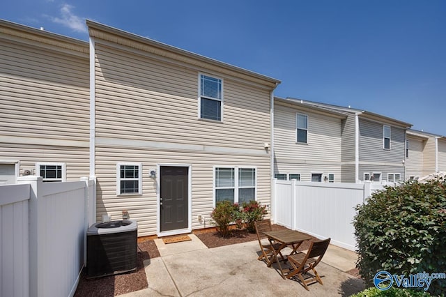 back of house with cooling unit and a patio area