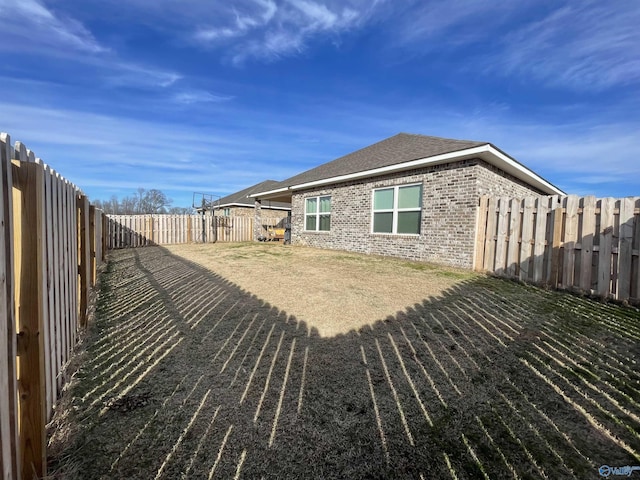 view of property exterior with a lawn