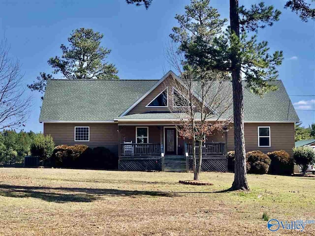 view of front of property with a porch and a front lawn