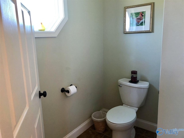 bathroom featuring tile patterned floors and toilet