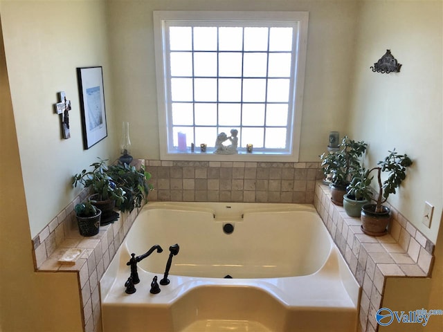 bathroom with a tub to relax in