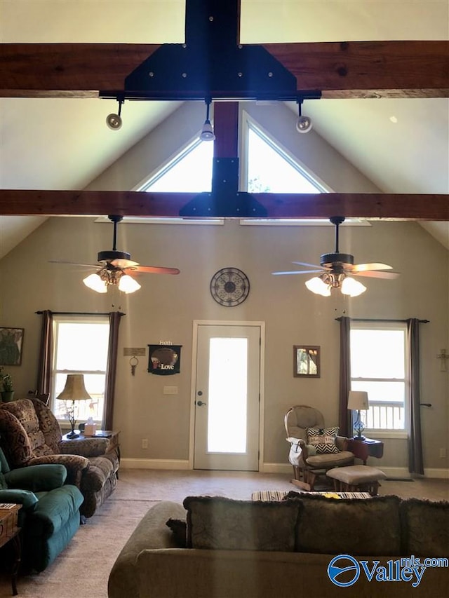 living room featuring beam ceiling, ceiling fan, high vaulted ceiling, and light colored carpet