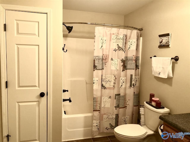 full bathroom with tile patterned floors, shower / bath combo, toilet, and vanity