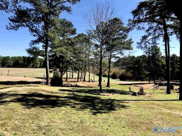 view of property's community with a lawn