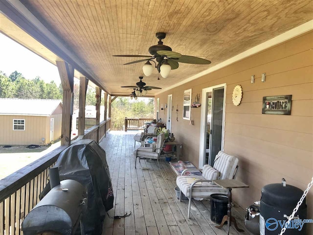 deck featuring covered porch and area for grilling