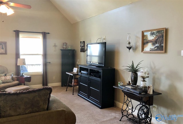 carpeted living room with ceiling fan and lofted ceiling