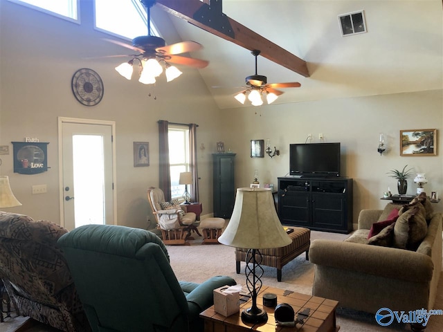 living room featuring beam ceiling, light colored carpet, high vaulted ceiling, and a wealth of natural light