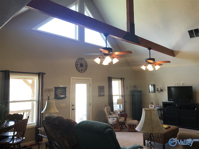 living room with carpet, ceiling fan, beamed ceiling, and high vaulted ceiling