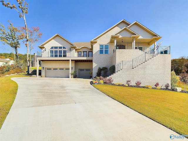 view of front of property with a front yard and a garage