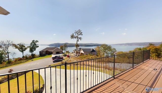 balcony with a water and mountain view