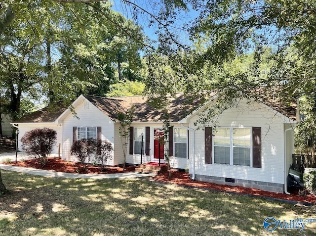 single story home featuring crawl space, a shingled roof, and a front lawn