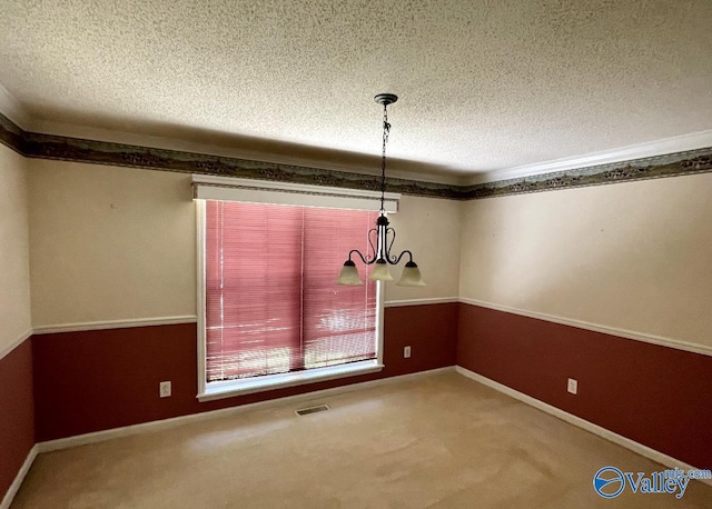 unfurnished dining area featuring an inviting chandelier, a textured ceiling, visible vents, and carpet flooring