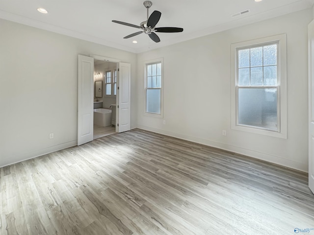 unfurnished bedroom with crown molding, ceiling fan, connected bathroom, and light hardwood / wood-style flooring