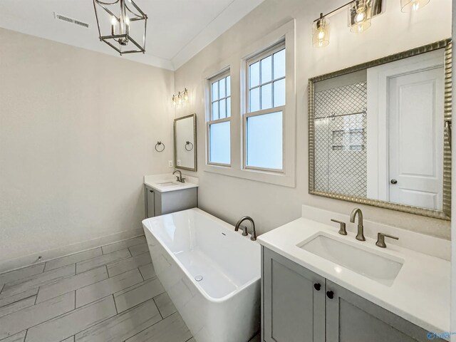 bathroom with ornamental molding, vanity, and plus walk in shower