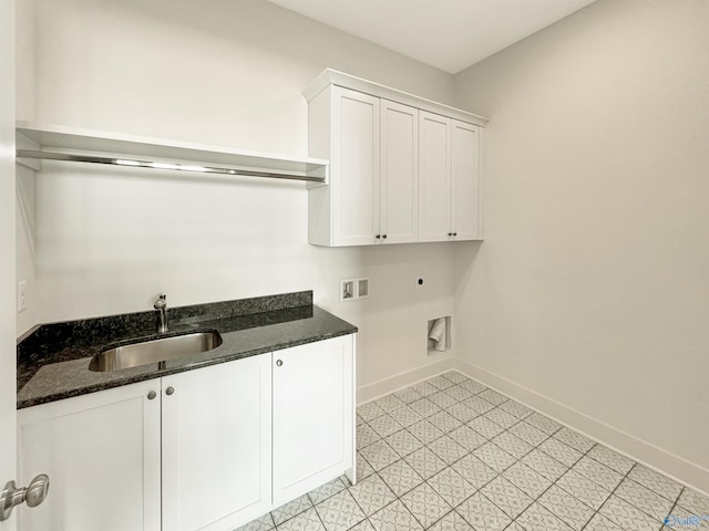 laundry area featuring cabinets, electric dryer hookup, sink, and washer hookup