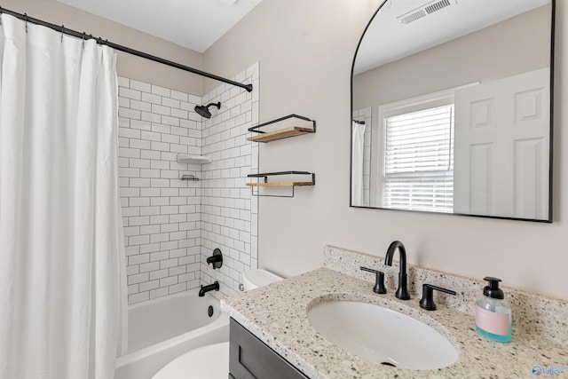 full bathroom with toilet, shower / tub combo, and vanity