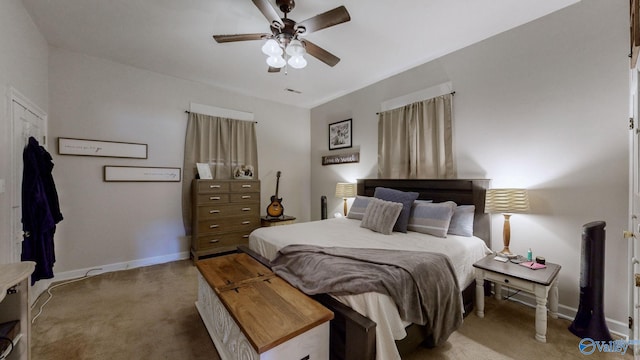 bedroom featuring ceiling fan and light carpet