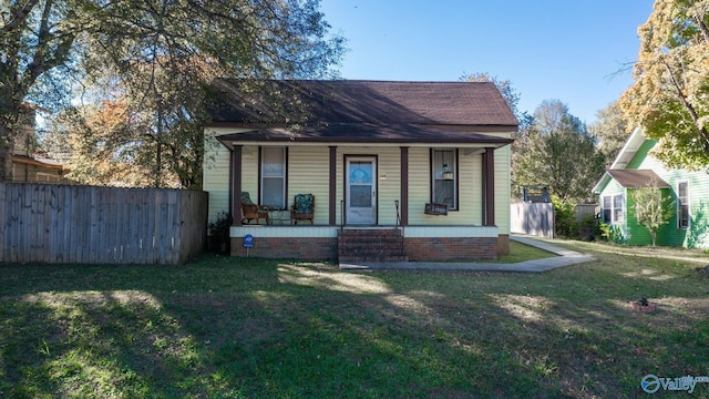 bungalow-style home featuring a front yard and a porch